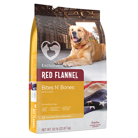 Red Flannel Bites N’ Bones Dry Dog Food. Gold pet food bag. Featuring adult dog in barn doorway.