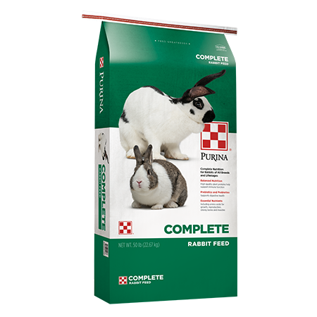 Purina Complete Rabbit Feed. Green and white feed bag, two spotted rabbits.