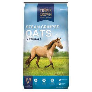 Triple Crown Naturals Steam Crimped Oats. Blue equine 50-lb feed bag. Tan horse in green field. Oats for horses.